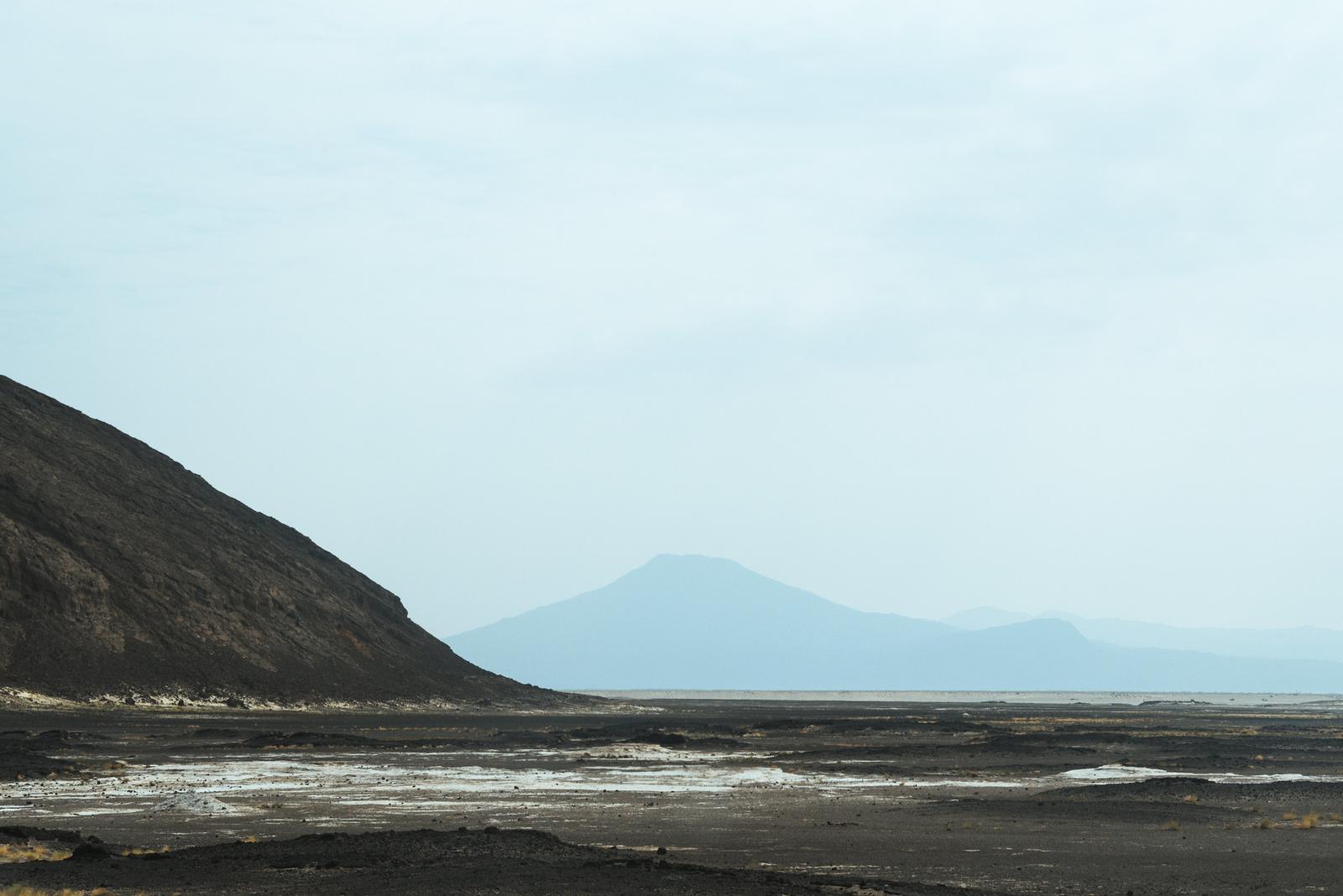 Desert on Top of Mountainous Backdrop